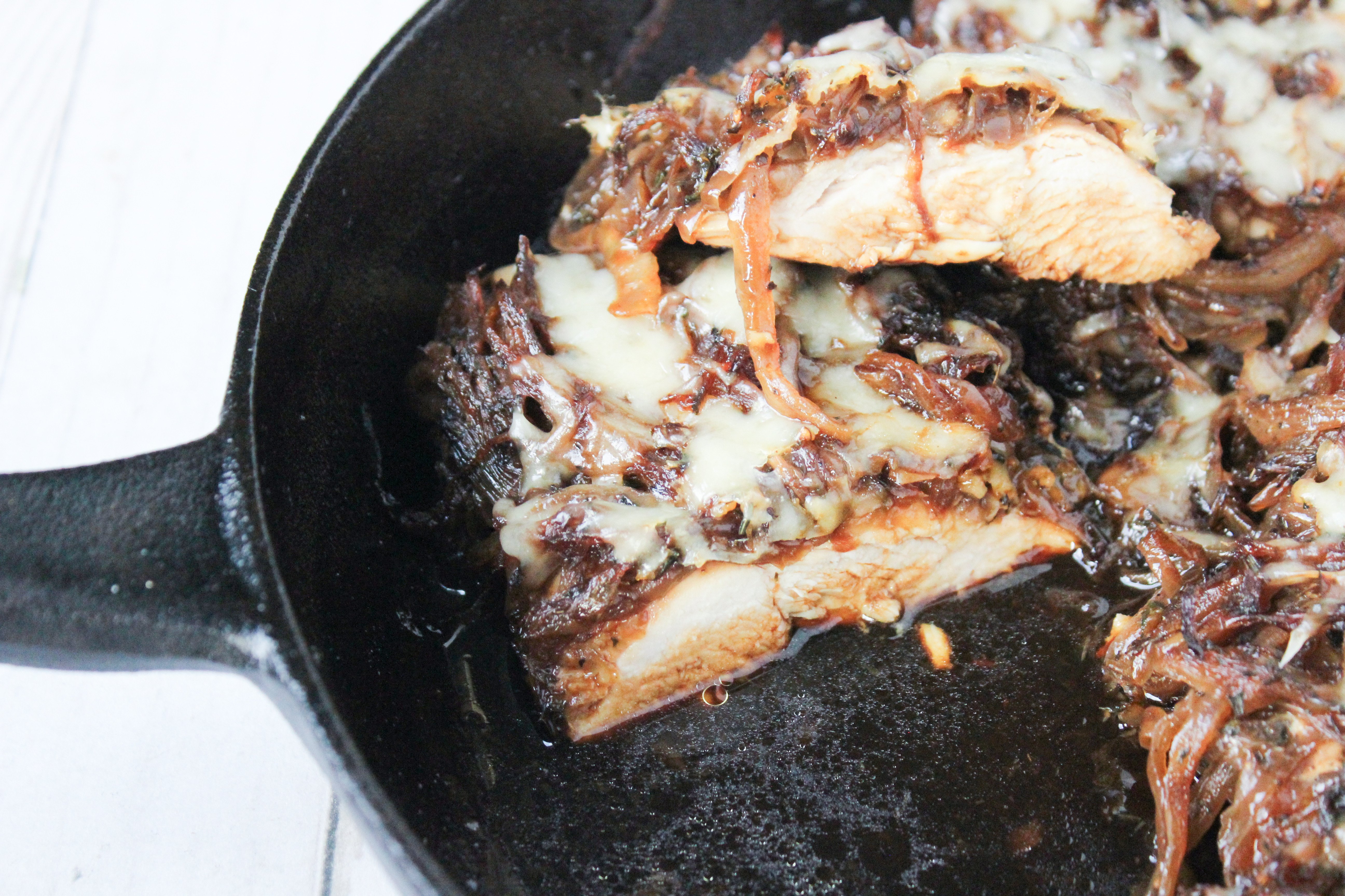 Cast Iron dish with chicken and french onion ingredients 